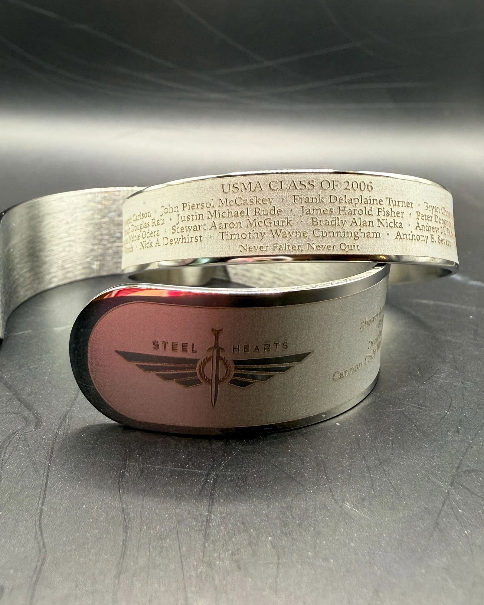 Finished USMA Class of 2006 bracelets showing the approved 18-name roster and Steel Hearts mark.